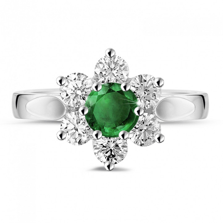 Flower ring in white gold with a round emerald and side diamonds