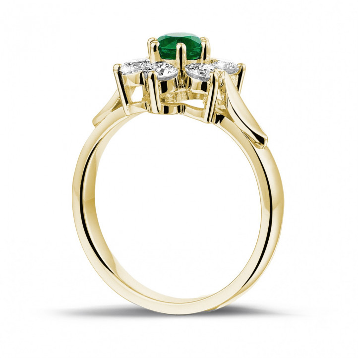 Flower ring in yellow gold with a round emerald and side diamonds
