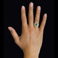 Entourage ring in yellow gold with an oval emerald and round diamonds