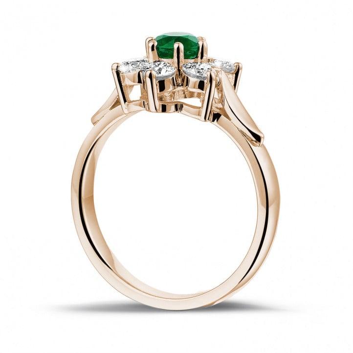 Flower ring in red gold with a round emerald and side diamonds