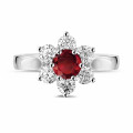 Flower ring in white gold with a round ruby and side diamonds