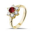 Flower ring in yellow gold with a round ruby and side diamonds