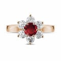 Flower ring in red gold with a round ruby and side diamonds