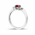 Trilogy ring in platinum with a central ruby and 2 round diamonds