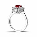 Entourage ring in platinum with an oval ruby and round diamonds