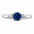 Trilogy ring in white gold with a central sapphire and 2 round diamonds