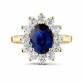 Entourage ring in yellow gold with an oval sapphire and round diamonds