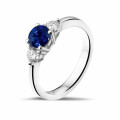 Trilogy ring in platinum with a central sapphire and 2 round diamonds