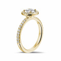 0.70 carat solitaire halo ring in yellow gold with round diamonds