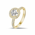 1.00 carat solitaire halo ring in yellow gold with round diamonds