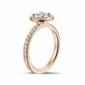 0.70 carat solitaire halo ring in red gold with round diamonds
