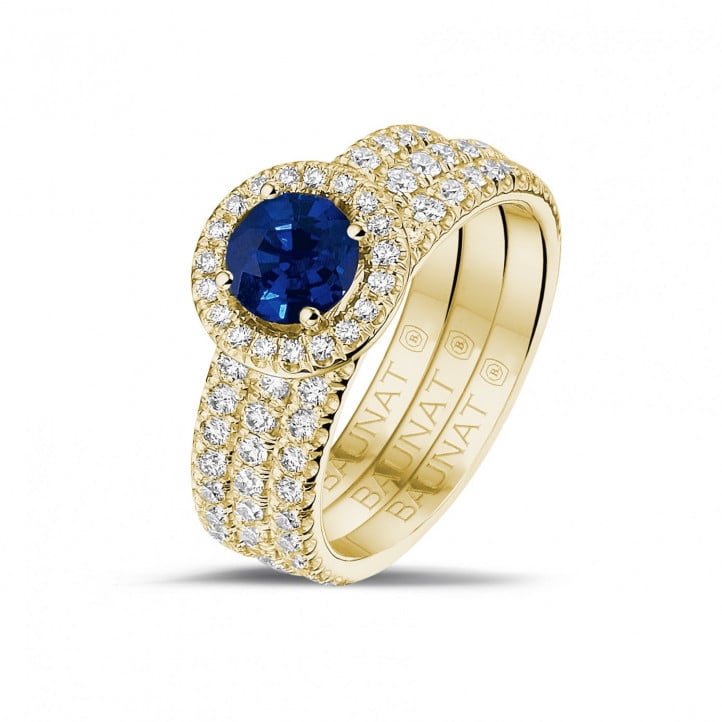 Halo solitaire ring in yellow gold with a round sapphire and small diamonds