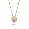 0.50 carat diamond halo necklace in red gold