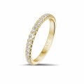0.35 carat eternity ring (half set) in yellow gold with round diamonds