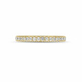 0.35 carat eternity ring (half set) in yellow gold with round diamonds