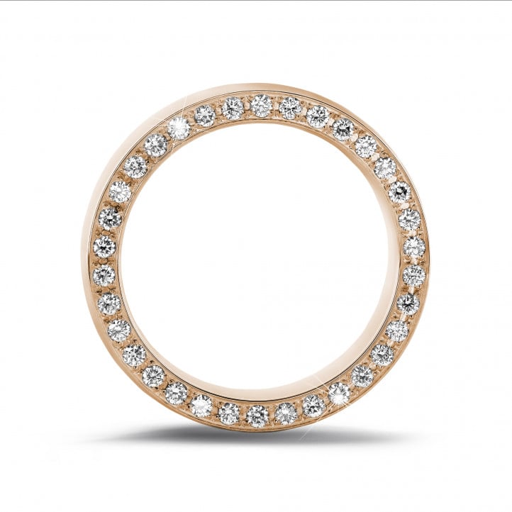 0.70 carat eternity ring in red gold with small round diamonds on the side