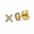 XO earrings in yellow gold with small round diamonds