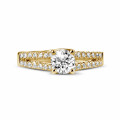 0.50 carat solitaire ring in yellow gold with side diamonds