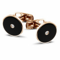 Red golden cufflinks with onyx and a central diamond