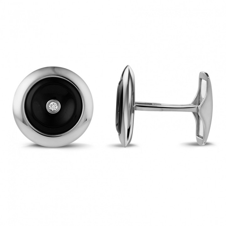 White golden cufflinks with onyx and a central diamond