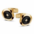 Yellow golden cufflinks with onyx and a central diamond