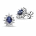 Entourage earrings in platinum with oval sapphire and round diamonds