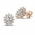 1.75 carat entourage earrings in red gold with oval and round diamonds