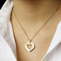0.36 carat heart shaped yellow golden pendant with small round diamonds
