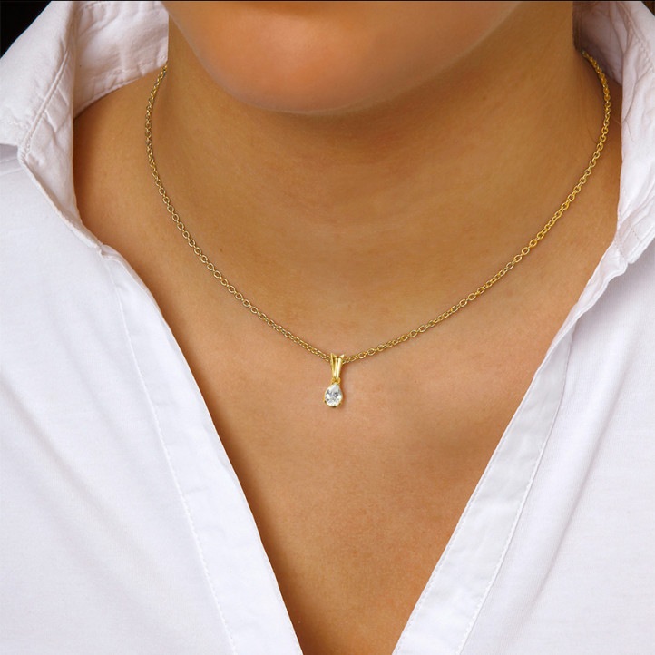 0.75 carat yellow golden solitaire pendant with pear shaped diamond