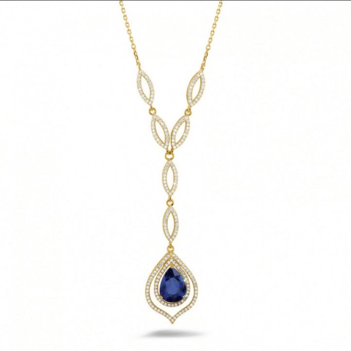 Diamond yellow golden necklace with a pear shaped sapphire