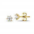 0.60 carat classic diamond earrings in yellow gold with six prongs