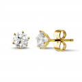 1.00 carat classic diamond earrings in yellow gold with six prongs