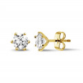 1.50 carat classic diamond earrings in yellow gold with six prongs