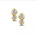 0.44 carat diamond earrings in yellow gold