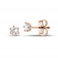 0.30 carat classic diamond earrings in red gold with six prongs