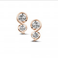 0.70 carat diamond earrings in red gold