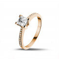 0.70 carat solitaire ring in red gold with princess diamond and side diamonds