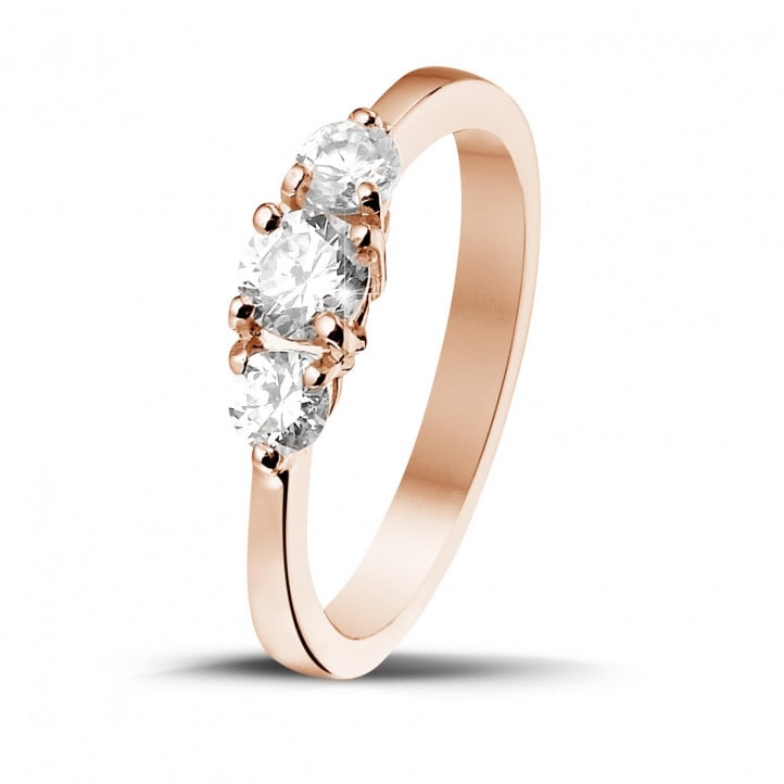 0.67 carat trilogy ring in red gold with round diamonds