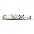 0.35 carat trilogy ring in red gold with round diamonds