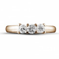 0.75 carat trilogy ring in red gold with round diamonds