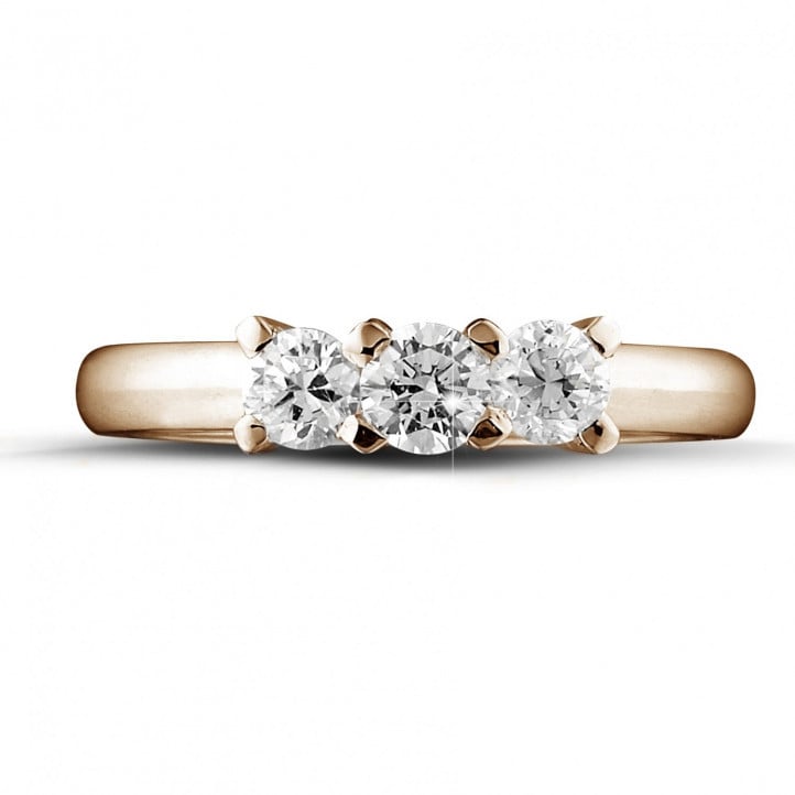 0.75 carat trilogy ring in red gold with round diamonds