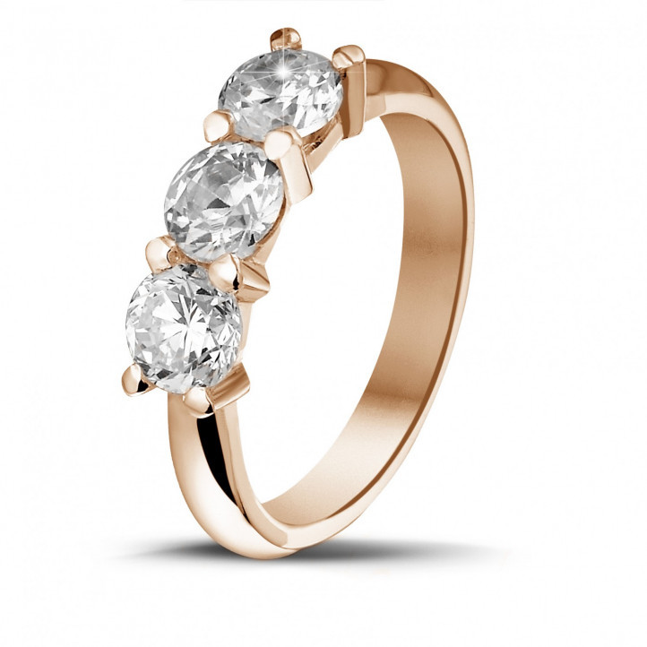 2.05 carat trilogy ring in red gold with round diamonds
