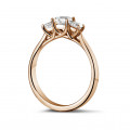 0.70 carat trilogy ring in red gold with princess diamonds