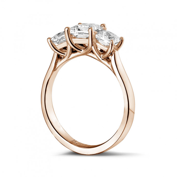 1.50 carat trilogy ring in red gold with princess diamonds