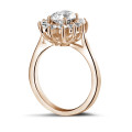 1.85 carat entourage ring in red gold with oval diamond