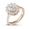 1.85 carat entourage ring in red gold with oval diamond