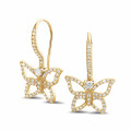 0.70 carat diamond butterfly designed earrings in yellow gold