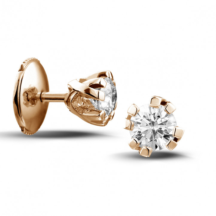 0.60 carat diamond design earrings in red gold with eight prongs