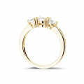 1.10 carat trilogy ring in yellow gold with side diamonds