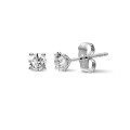 1.00 carat classic diamond earrings in white gold with four prongs